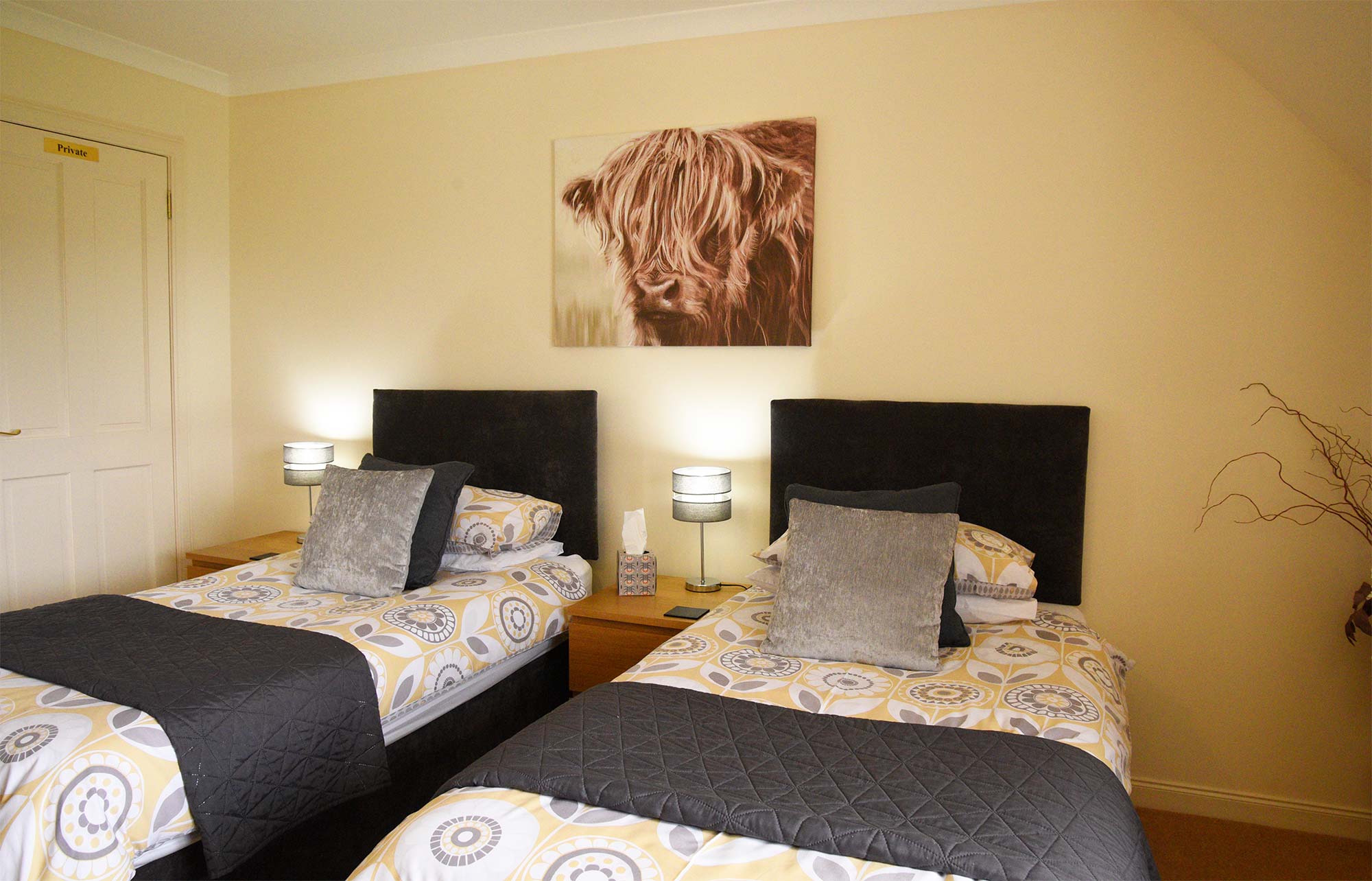 Our twin room with TV and private seating area